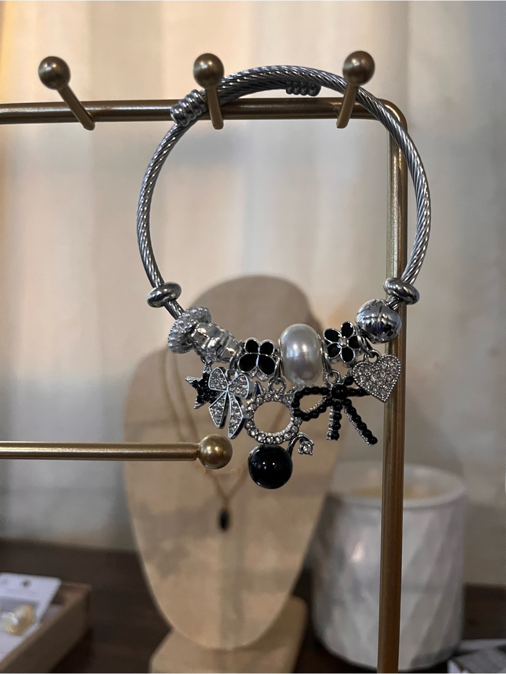 Silver-Tone Black & White Charm Bracelet Water resistant.